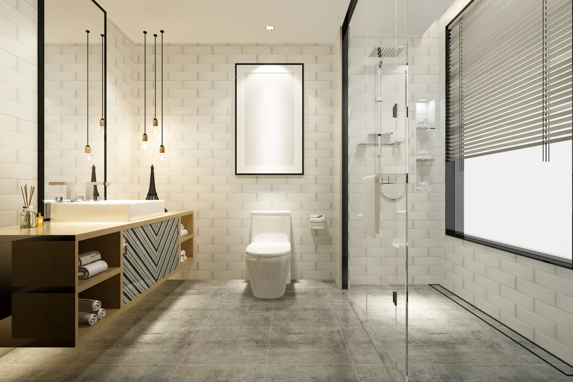 A photo of a white tiled bathroom with a toilet in the center and a class-walled shower to the right.