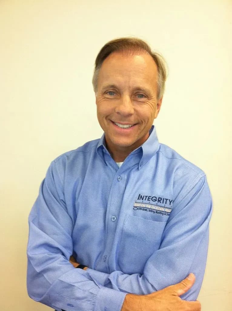 A Photo of owner Danny Peterson in a blue Integrity Home Pro collared shirt.