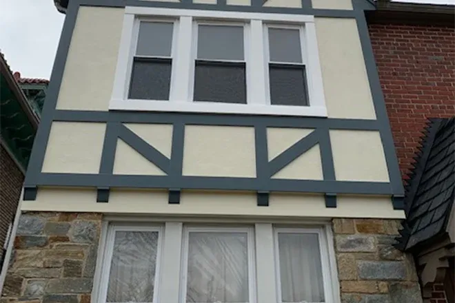 White horizontal fiber cement siding home addition above garage - Integrity Home Pro