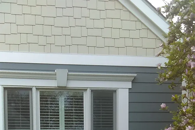 House with blue horizontal fiber cement siding and beige shake fiber cement siding - Integrity Home Pro