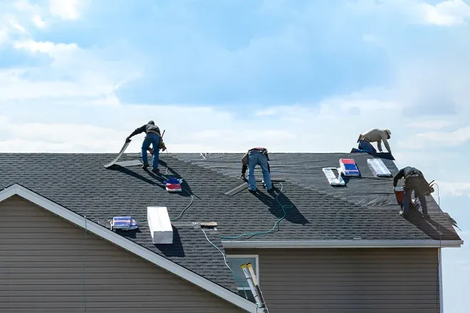 Pro roofers replacing a roof.