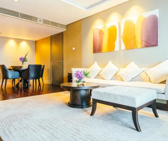 A remodeled basement living room and dining area in a modern apartment.